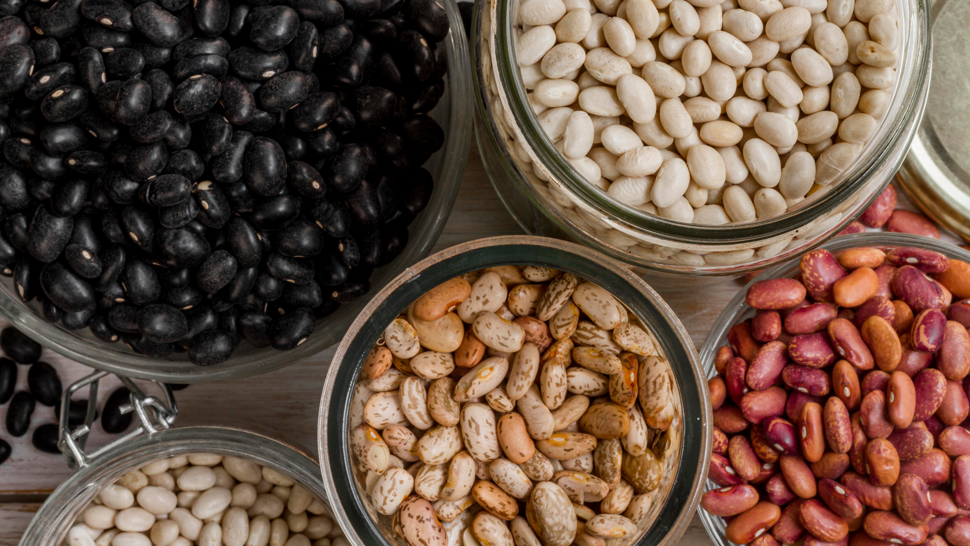 Variety of beans in glass jars